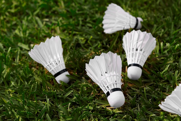 Free Photo badminton shuttlecocks on grass