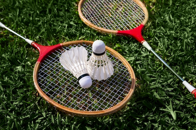 Free Photo badminton shuttlecocks and racket high angle