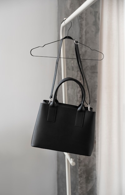 Free Photo bag hanging from furniture item indoors