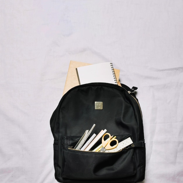 Free photo bag with sketchbooks and office supplies