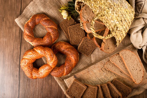 Bagel and slices of dark bread in basket