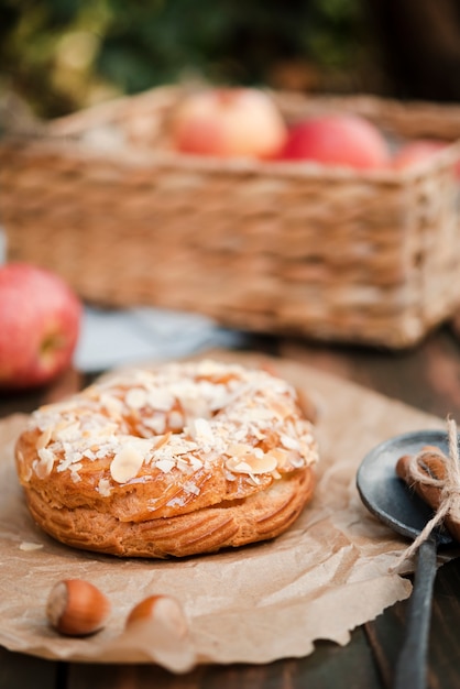 Bagel with chestnuts and basket of apples