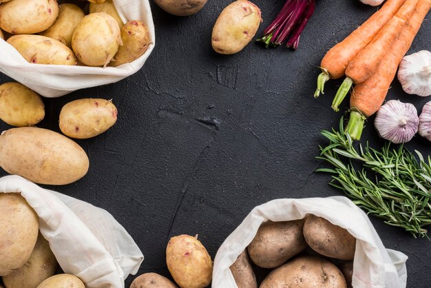 Bags with potatoes and other vegetables