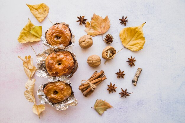 Baked apples in foil on table