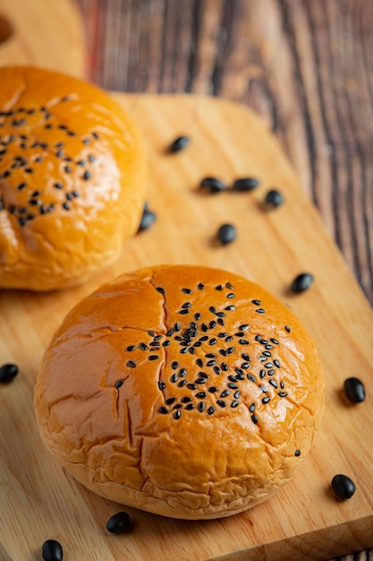 baked black bean paste buns on wooden cutting board