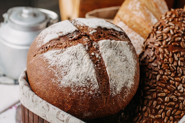 baked bread brown and black with flour whole tasty inside basket