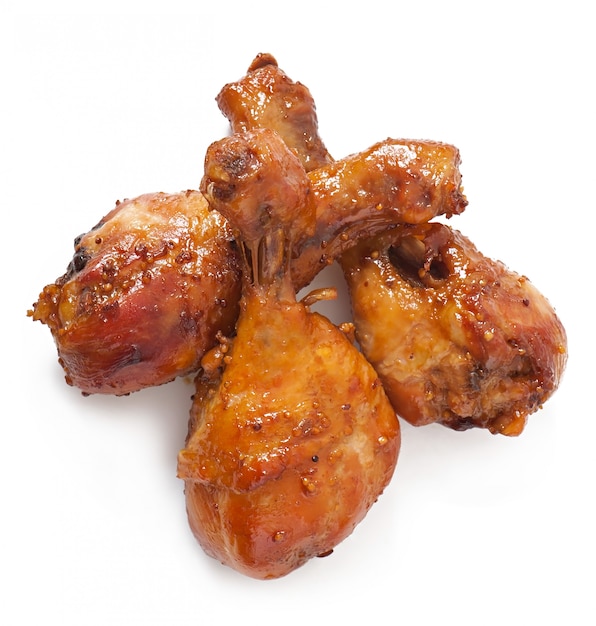 Free photo baked chicken drumsticks in honey-mustard marinade