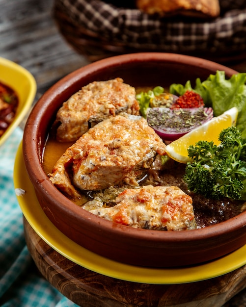 Baked fish  with lemon side view