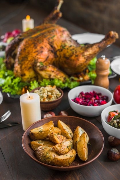 Baked turkey with food bowls 