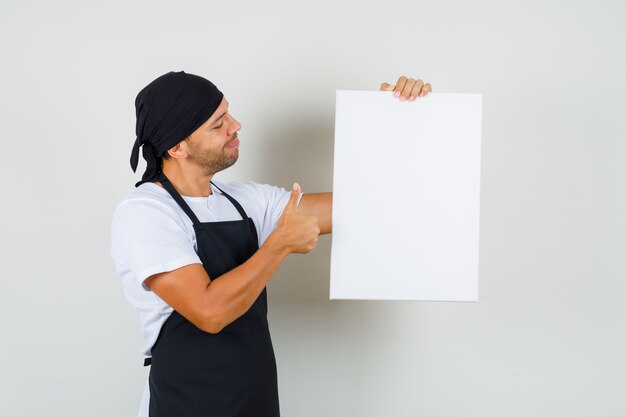 Baker man holding empty canvas