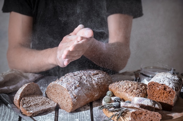 Free photo baker with flour in hand