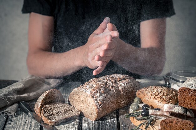 baker with flour in hand