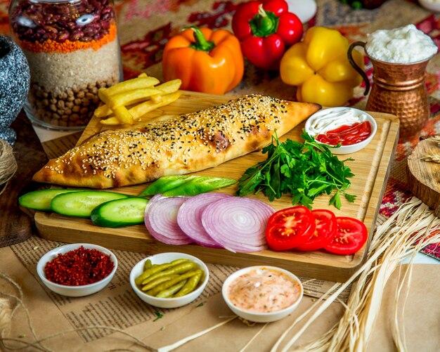 Bakery with sesame topping and various sliced vegetables