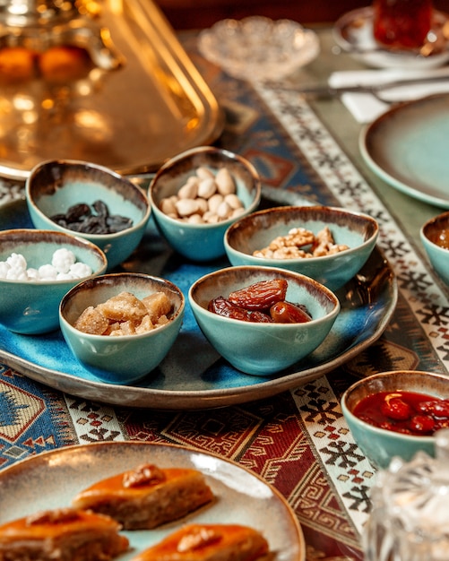 Free photo baklava and dried fruits with nuts on the table