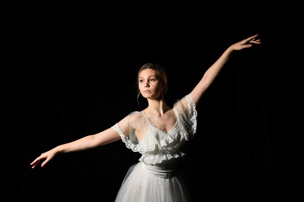 Ballerina on dress and tutu posing