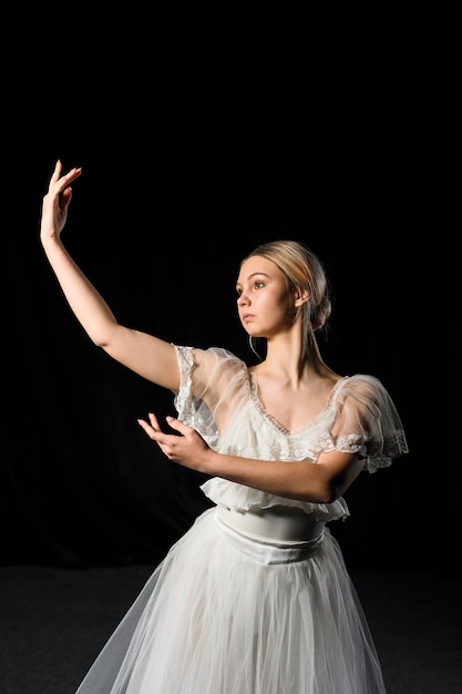 Free Photo ballerina posing while wearing tutu dress