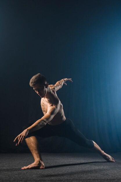 Ballerino posing in tights with copy space