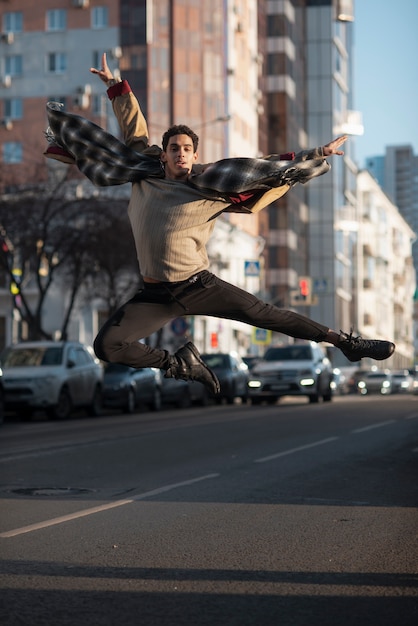 Free photo ballet dancer jumping in the air