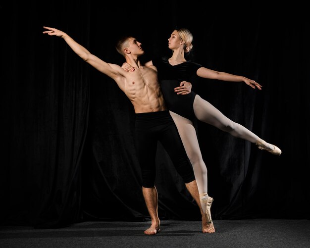 Ballet dancers posing with arms out