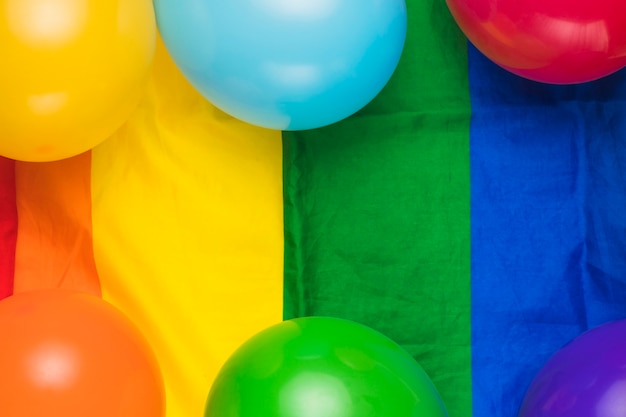 Balloons on striped rainbow flag