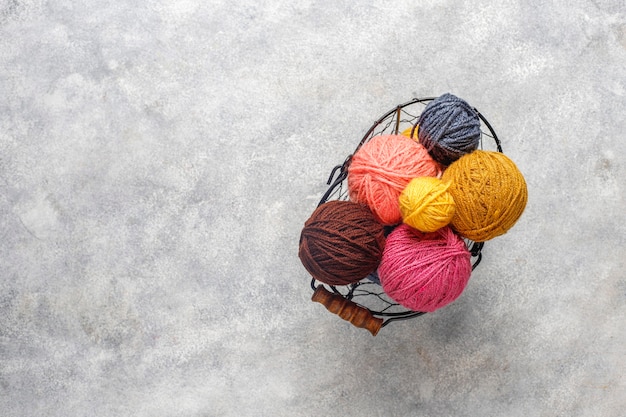 Free Photo balls of yarn in different colors with knitting needles.