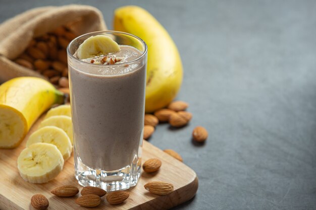 Banana almond smoothie on dark background