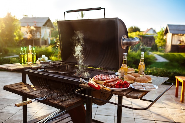 Free Photo barbecue grill party. tasty food on wooden desk.