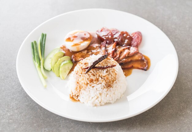 Barbecued red pork in sauce with rice