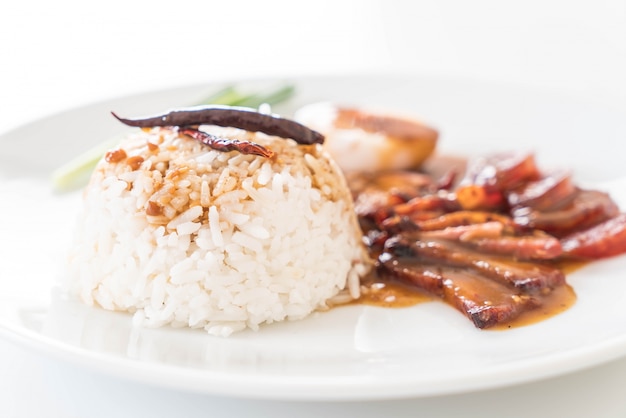 Barbecued red pork in sauce with rice