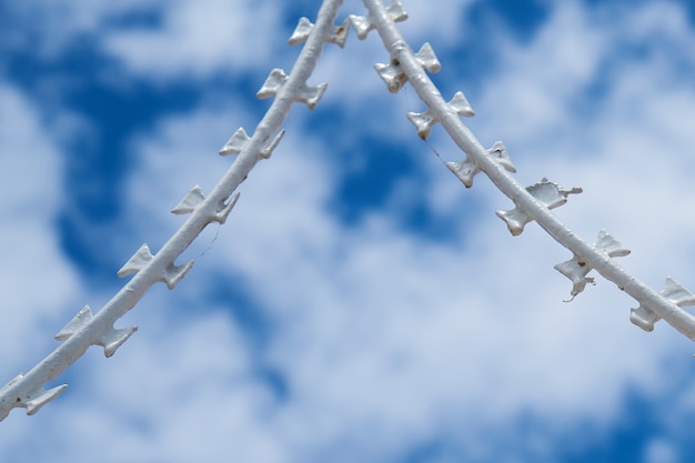 Free Photo barbed wire and cloudy sky