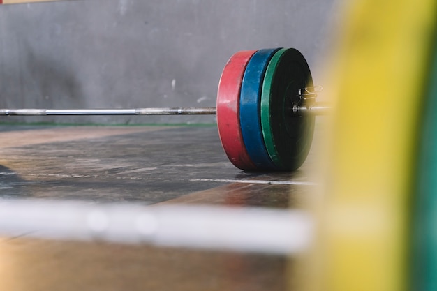 Barbell lying in gym