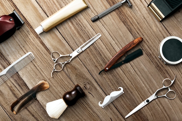 Free photo barber tools wallpaper pattern wooden background job and career concept