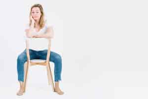 Free photo barefoot woman on chair