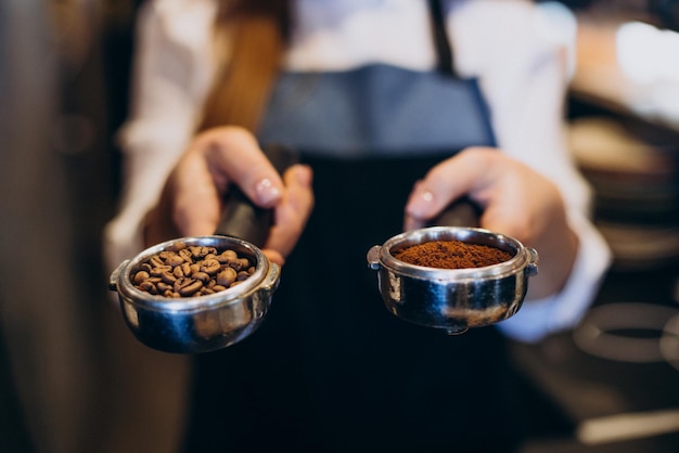 Free Photo barista at a coffee house with portafilter holders