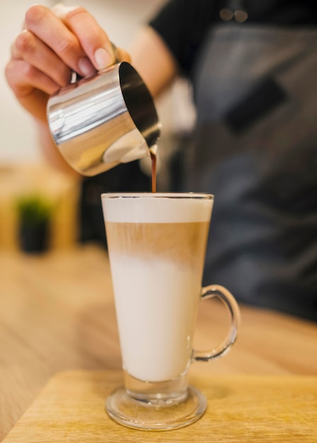 Free photo barista making coffee beverage