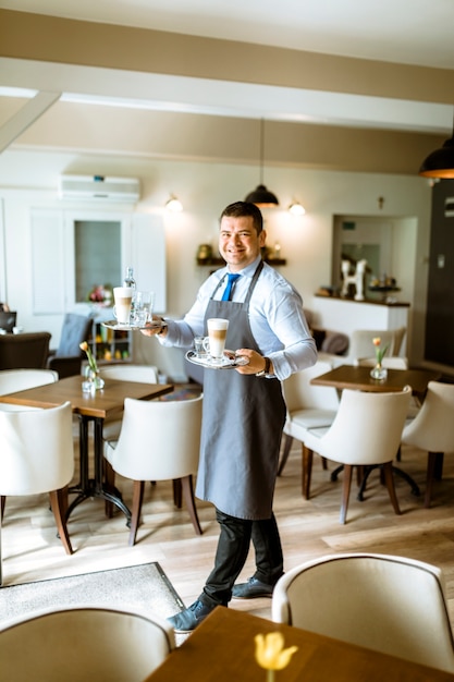 Barman carrying coffee