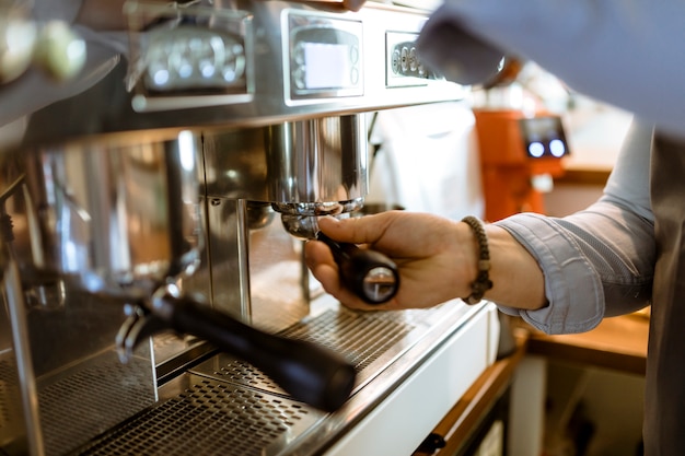 Free photo barman using coffee machine