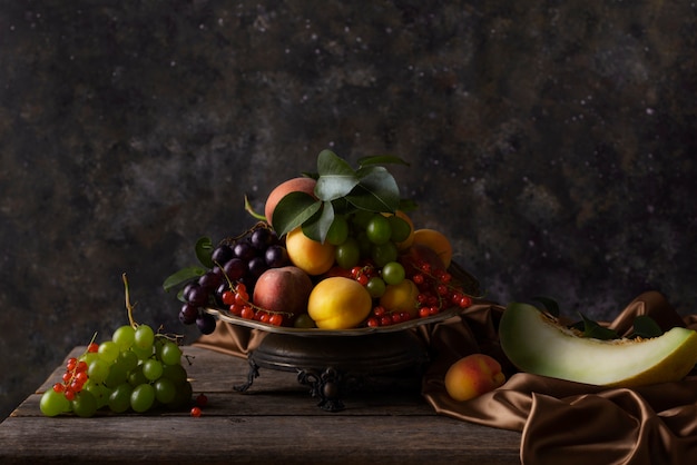 Baroque style with fruits and cloth arrangement