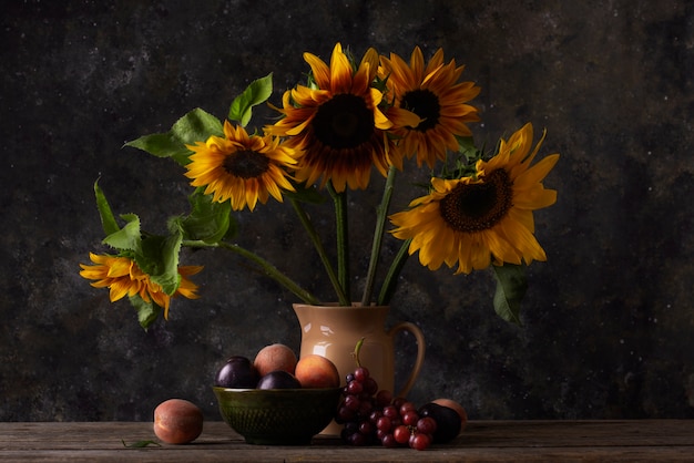 Free photo baroque style with sunflowers and fruits assortment