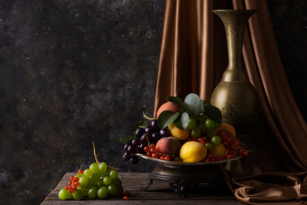 Free Photo baroque style with vase and fruits