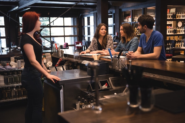 Bartender interacting with customers