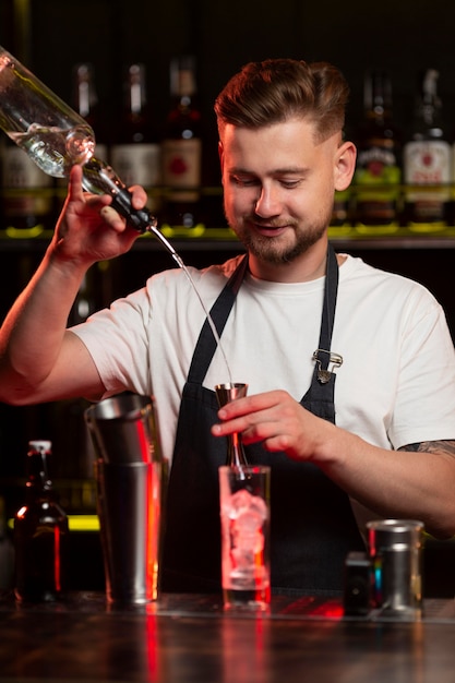 Bartender making a cocktail with a shaker