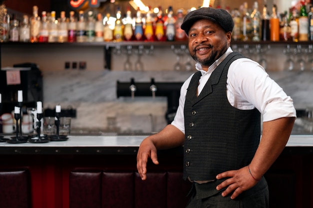 Bartender preparing drink at bar