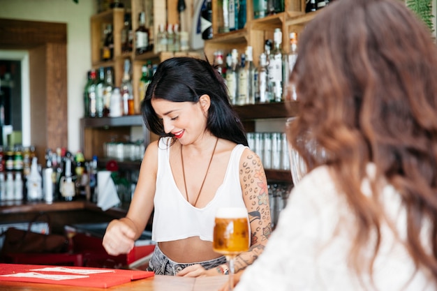 Bartender and woman with beer