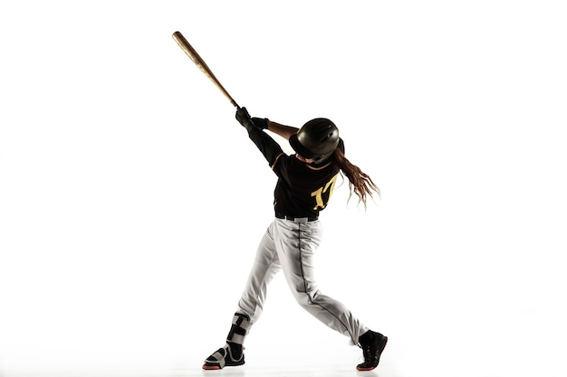 Free photo baseball player, pitcher in a black uniform practicing and training isolated on a white background.