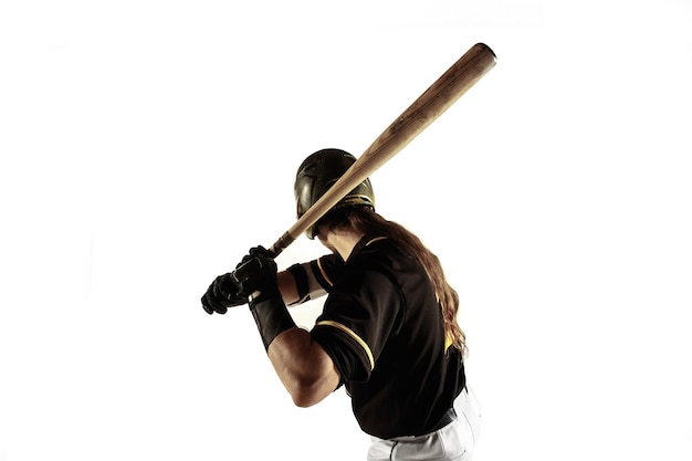 Free photo baseball player, pitcher in a black uniform practicing and training isolated on a white background.