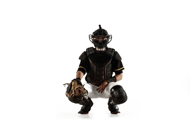 Baseball player, pitcher in a black uniform practicing and training isolated on a white background.