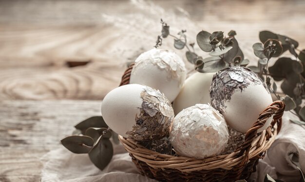 Basket with eggs and dried flowers. An original idea for decorating Easter eggs.