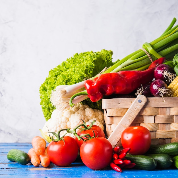 Basket with healthy raw vegetables