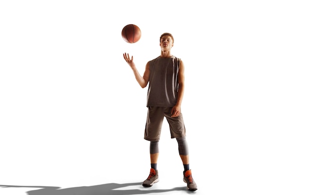 Basketball player in action on sunset